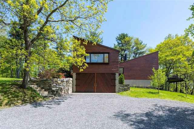 82 Moadock Rd, Millerton, NY 12546 - view of front of home with gravel driveway and a garage