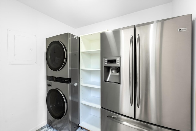82 Moadock Rd, Millerton, NY 12546 - laundry area with stacked washer and clothes dryer, electric panel, and baseboards