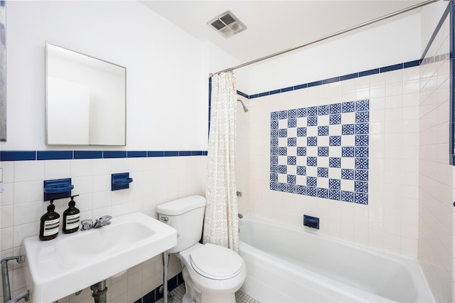 82 Moadock Rd, Millerton, NY 12546 - full bathroom featuring toilet, shower / tub combo, tile walls, and wainscoting