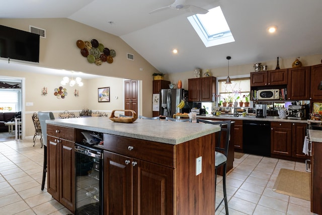 11 Crescent St, Mastic, NY 11950 - kitchen featuring black dishwasher, beverage cooler, stainless steel fridge with ice dispenser, light tile patterned floors, and a skylight