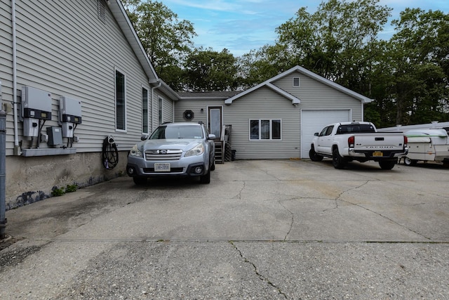 11 Crescent St, Mastic, NY 11950 - view of side of home with a garage
