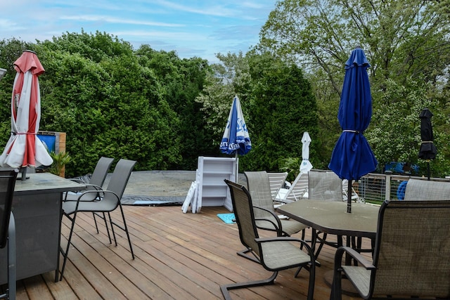 11 Crescent St, Mastic, NY 11950 - wooden terrace featuring outdoor dining area