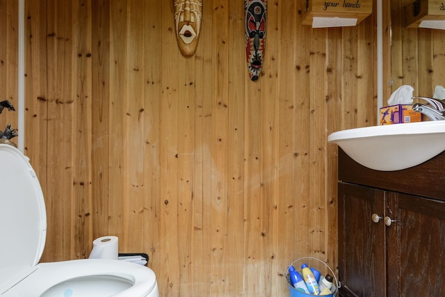 11 Crescent St, Mastic, NY 11950 - bathroom with toilet, vanity, and wooden walls