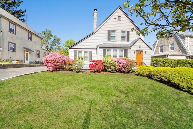 26 Alta Dr, Mount Vernon, NY 10552 - view of front facade featuring a chimney and a front yard