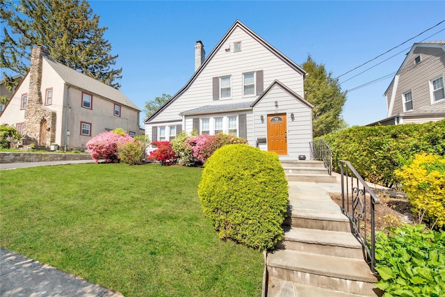 26 Alta Dr, Mount Vernon, NY 10552 - view of front of property featuring a front lawn and a chimney