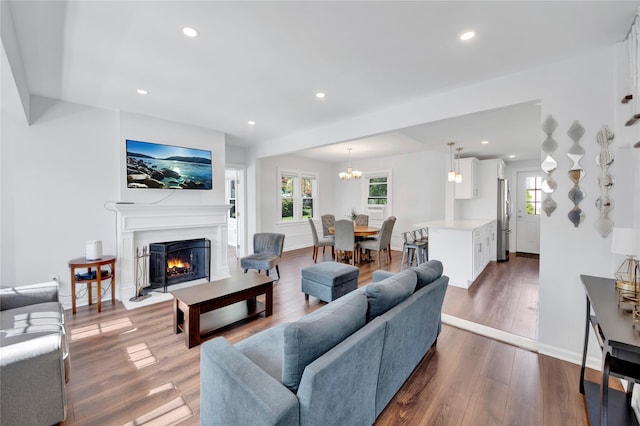 26 Alta Dr, Mount Vernon, NY 10552 - living area with dark wood finished floors, a chandelier, a fireplace with flush hearth, recessed lighting, and baseboards