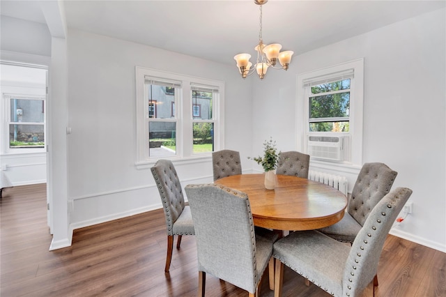 26 Alta Dr, Mount Vernon, NY 10552 - dining area featuring plenty of natural light, a chandelier, radiator heating unit, and wood finished floors