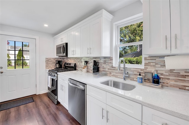 26 Alta Dr, Mount Vernon, NY 10552 - kitchen with stainless steel appliances, a sink, white cabinets, light stone counters, and dark wood-type flooring