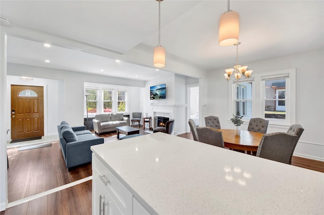 26 Alta Dr, Mount Vernon, NY 10552 - kitchen featuring hanging light fixtures, white cabinetry, dark wood finished floors, a lit fireplace, and recessed lighting