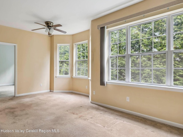 212 Commons Ln, Saugerties, NY 12477 - carpeted spare room featuring healthy amount of natural light, baseboards, and a ceiling fan