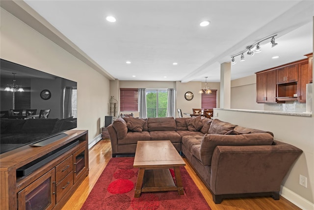 80 E Hartsdale Ave Unit 520, Hartsdale, NY 10530 - living area featuring a chandelier, baseboard heating, light wood finished floors, recessed lighting, and baseboards