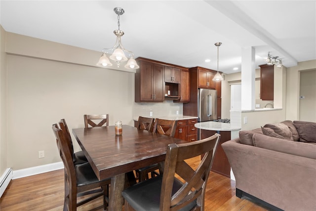 80 E Hartsdale Ave Unit 520, Hartsdale, NY 10530 - dining room featuring light wood-type flooring, recessed lighting, baseboards, and baseboard heating