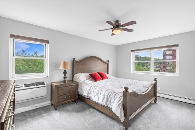 80 E Hartsdale Ave Unit 520, Hartsdale, NY 10530 - bedroom featuring light colored carpet, baseboard heating, a wall mounted AC, baseboards, and a ceiling fan