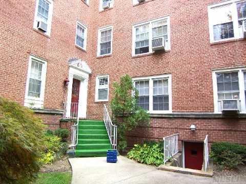230 Central Ave Unit 2-H, Lawrence, NY 11559 - entrance to property featuring brick siding
