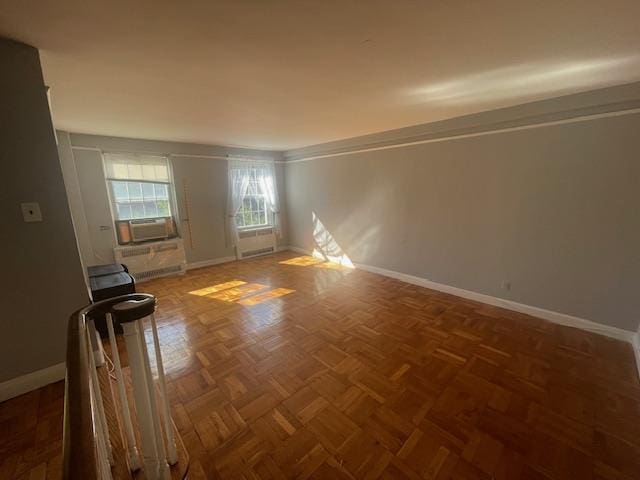 230 Central Ave Unit 2-H, Lawrence, NY 11559 - empty room with baseboards and cooling unit