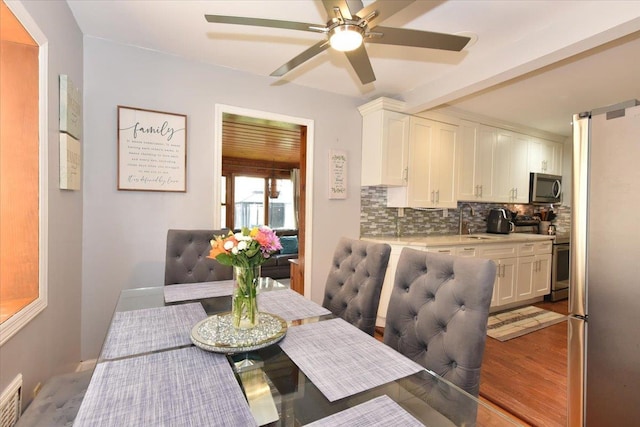 186 E Chester St, Valley Stream, NY 11580 - dining area featuring ceiling fan and light wood-type flooring