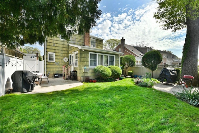 186 E Chester St, Valley Stream, NY 11580 - back of property with entry steps and a patio area