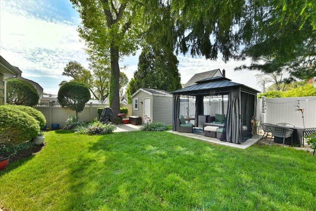 186 E Chester St, Valley Stream, NY 11580 - view of yard featuring a patio area, a gazebo, an outbuilding, an outdoor hangout area, and a storage unit