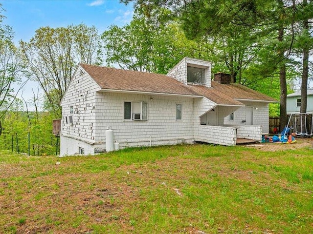 36 Starr Ave, Monticello, NY 12701 - rear view of property with a lawn
