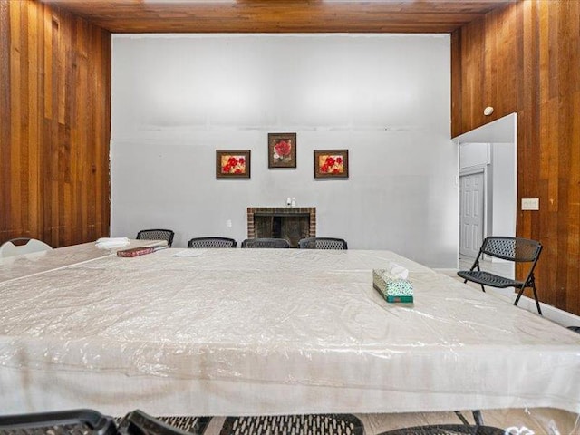 36 Starr Ave, Monticello, NY 12701 - bedroom featuring wood ceiling, wood walls, and a fireplace