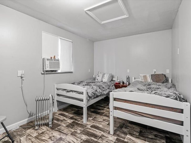 36 Starr Ave, Monticello, NY 12701 - bedroom featuring attic access, cooling unit, and radiator