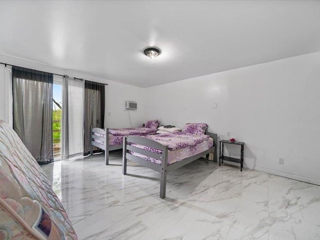 36 Starr Ave, Monticello, NY 12701 - bedroom with light marble finish floors and a wall unit AC