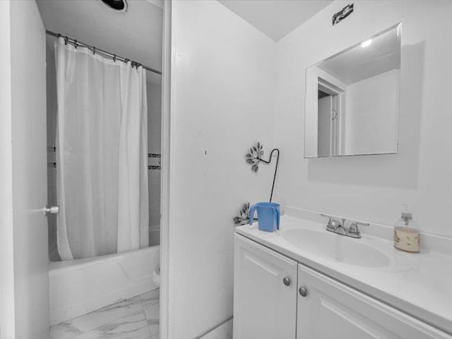 36 Starr Ave, Monticello, NY 12701 - bathroom featuring marble look tiles, vanity, shower / bath combination with curtain, and toilet