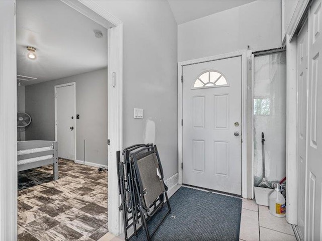 36 Starr Ave, Monticello, NY 12701 - entryway with baseboards and vaulted ceiling