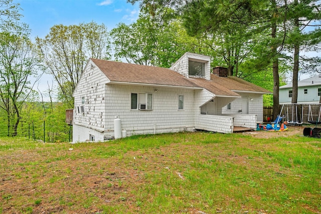 36 Starr Ave, Monticello, NY 12701 - rear view of property with a shingled roof, fence, and a chimney