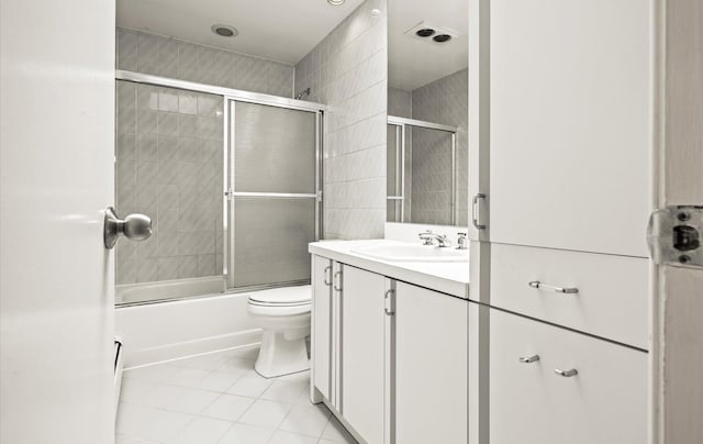 19 Walter Ct, Commack, NY 11725 - bathroom featuring tile patterned floors, vanity, bath / shower combo with glass door, and toilet