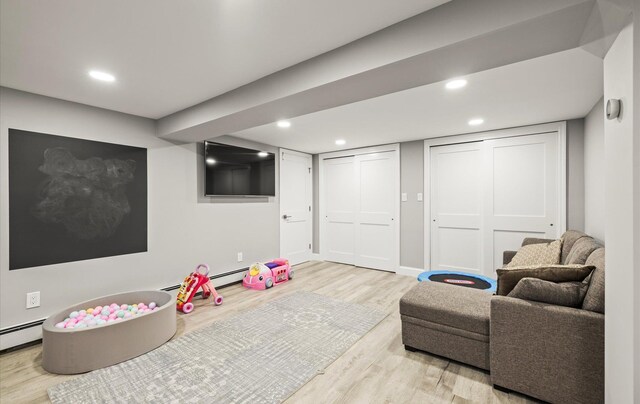 19 Walter Ct, Commack, NY 11725 - game room with light wood-style floors, baseboard heating, and recessed lighting