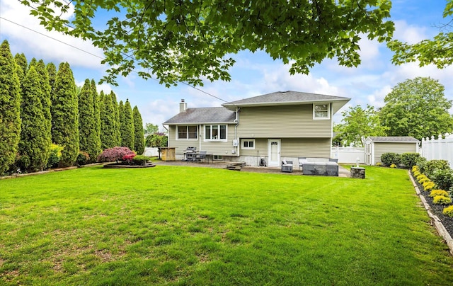 19 Walter Ct, Commack, NY 11725 - rear view of property with a patio area, a chimney, an outbuilding, and a shed