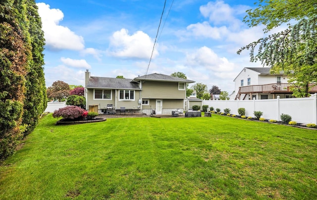 19 Walter Ct, Commack, NY 11725 - back of house featuring a patio area and a chimney