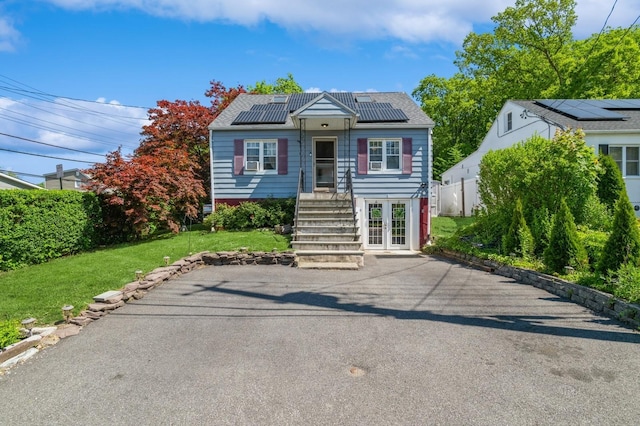722 Shenandoah Ave, Peekskill, NY 10566 - bungalow featuring roof mounted solar panels and french doors