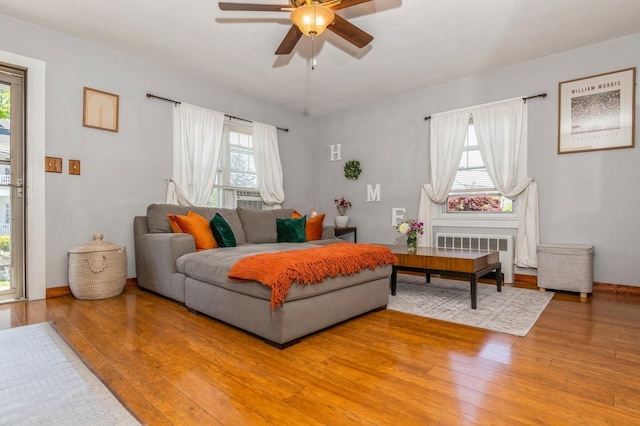 722 Shenandoah Ave, Peekskill, NY 10566 - living room with radiator heating unit, wood-type flooring, ceiling fan, and cooling unit
