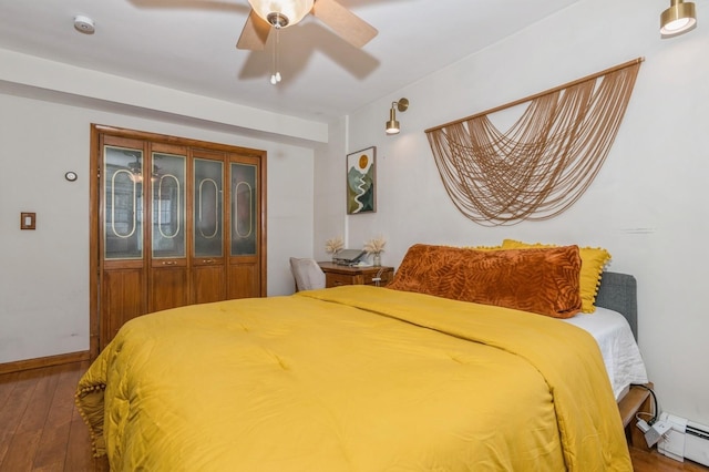 722 Shenandoah Ave, Peekskill, NY 10566 - bedroom featuring hardwood / wood-style floors, a baseboard heating unit, ceiling fan, and baseboards