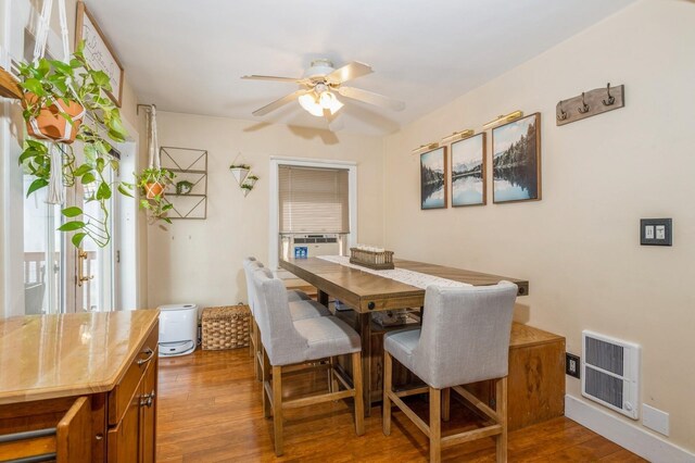 722 Shenandoah Ave, Peekskill, NY 10566 - dining room with wood finished floors, a ceiling fan, and plenty of natural light