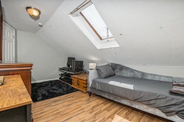 722 Shenandoah Ave, Peekskill, NY 10566 - living area with a skylight, wood finished floors, vaulted ceiling, and baseboards
