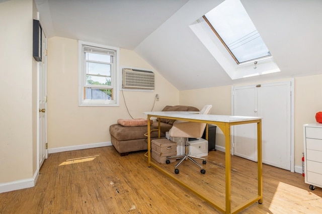 722 Shenandoah Ave, Peekskill, NY 10566 - home office with a skylight, light wood finished floors, a wall mounted air conditioner, baseboards, and vaulted ceiling