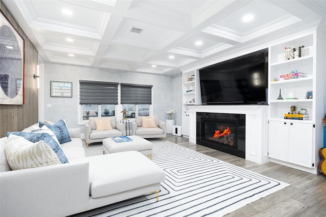 18 Heron Ct, Levittown, NY 11756 - living area with light wood finished floors, recessed lighting, coffered ceiling, a glass covered fireplace, and beamed ceiling