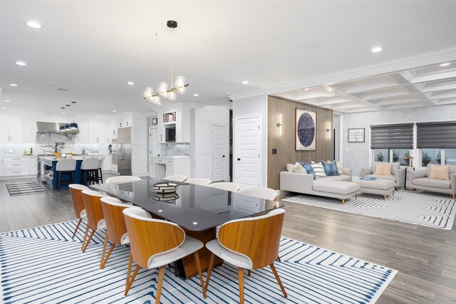18 Heron Ct, Levittown, NY 11756 - dining area featuring wood finished floors, recessed lighting, coffered ceiling, a chandelier, and beam ceiling