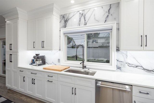 18 Heron Ct, Levittown, NY 11756 - kitchen featuring stainless steel dishwasher, a sink, white cabinets, light countertops, and dark wood-style floors