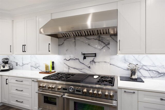 18 Heron Ct, Levittown, NY 11756 - kitchen featuring double oven range, wall chimney range hood, tasteful backsplash, and crown molding