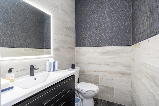 18 Heron Ct, Levittown, NY 11756 - half bathroom with tile walls, toilet, vanity, and wood finished floors