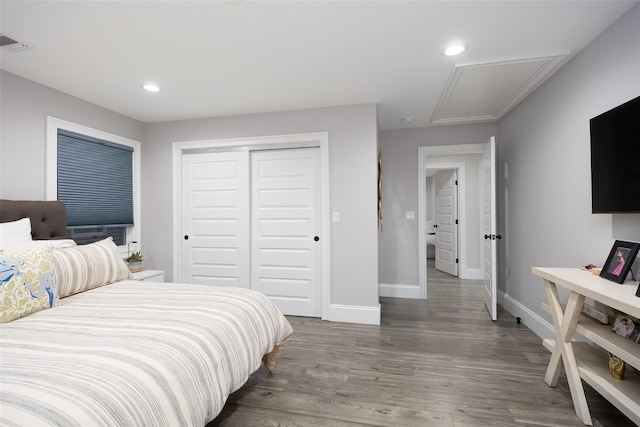 18 Heron Ct, Levittown, NY 11756 - bedroom featuring attic access, a closet, baseboards, wood finished floors, and recessed lighting