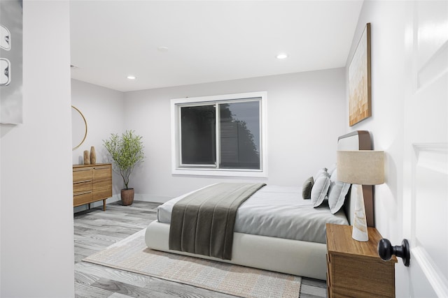 18 Heron Ct, Levittown, NY 11756 - bedroom featuring recessed lighting, wood finished floors, and baseboards