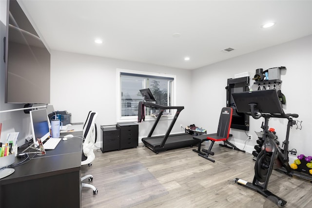 18 Heron Ct, Levittown, NY 11756 - exercise room featuring light wood finished floors, recessed lighting, and baseboards