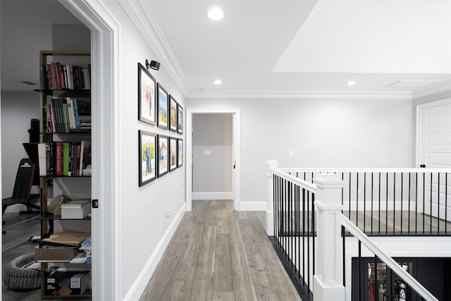 18 Heron Ct, Levittown, NY 11756 - hall featuring an upstairs landing, recessed lighting, ornamental molding, light wood finished floors, and baseboards
