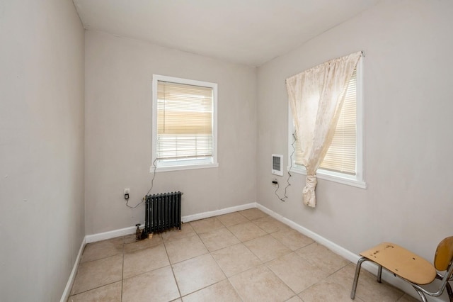 435 S Columbus Ave, Mount Vernon, NY 10553 - empty room with radiator, baseboards, light tile patterned floors, and heating unit