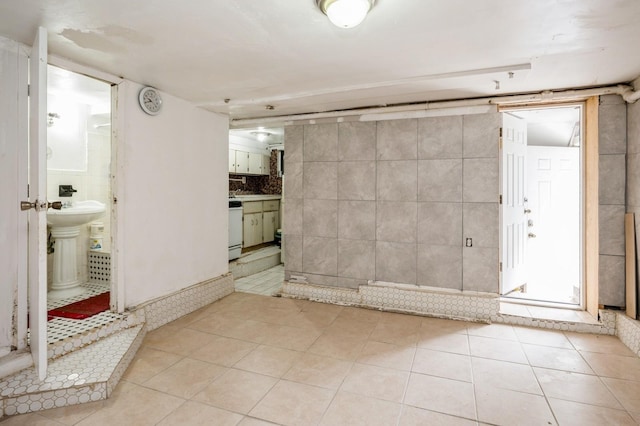 435 S Columbus Ave, Mount Vernon, NY 10553 - interior space featuring light tile patterned floors and tile walls